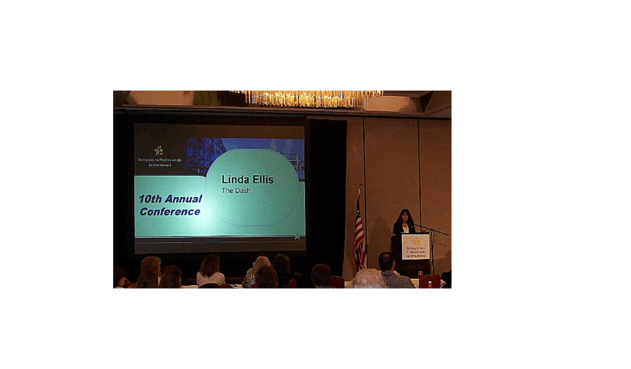 Linda Ellis speaking on stage